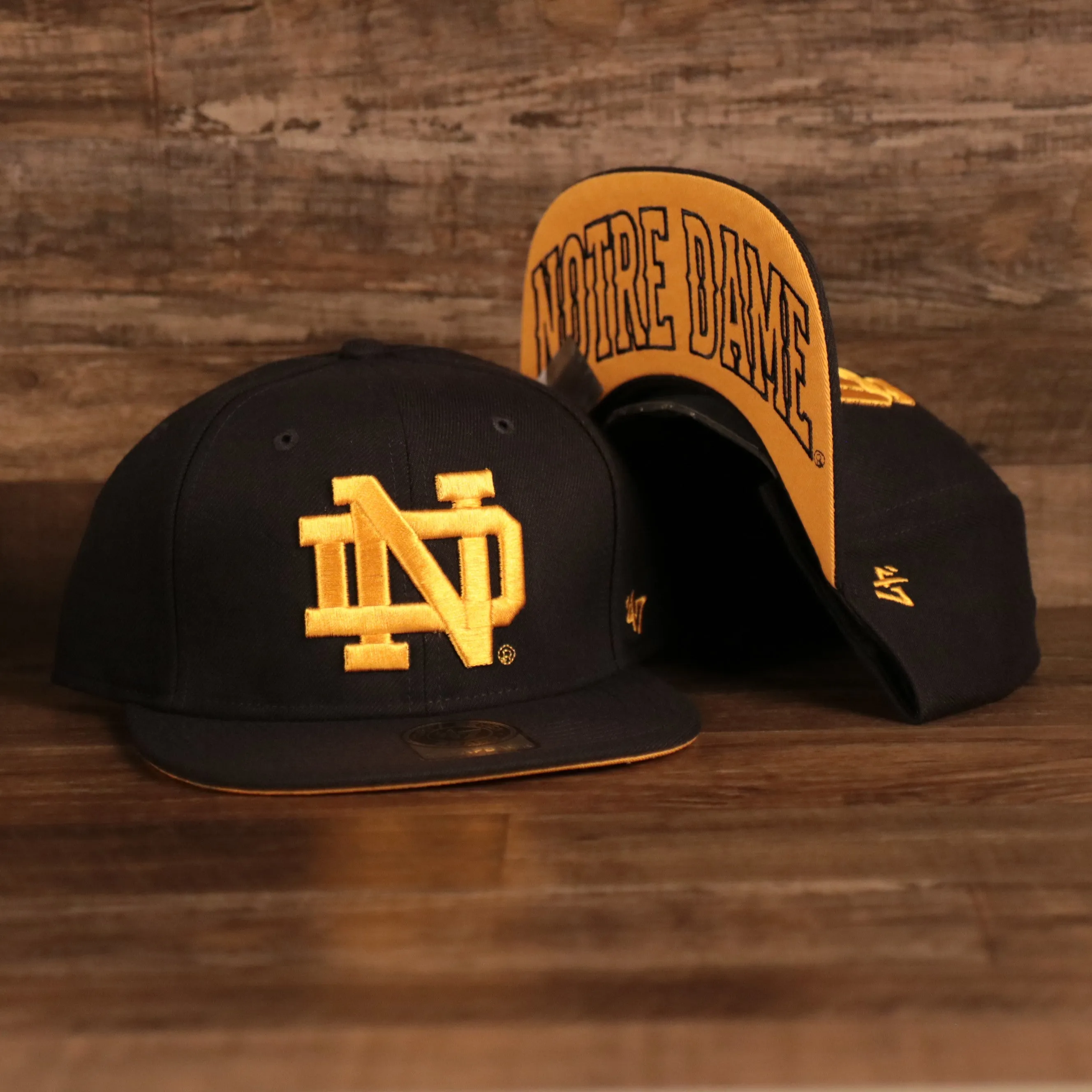 47 BRAND | NOTRE DAME FIGHTIN IRISH | THE SHAFT | GOLD UNDERBRIM W/ NOTRE DAME SCRIPT | ADJUSTABLE STRAPBACK | NAVY | OSFM